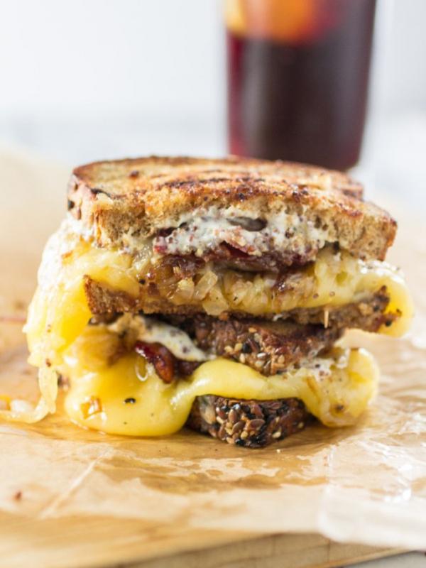 Grilled cheese sandwich made with gouda, caramelized onions, and maple bacon. (Via: oliviascuisine.com)