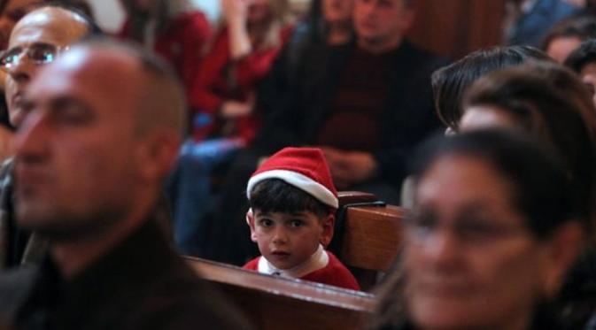 Misa Natal di sebuah gereja di Irak . (AFP)
