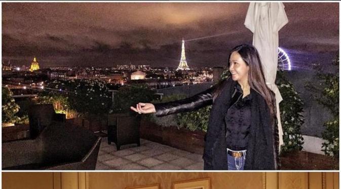 Maia Estianty sedang berpose dengan latar belakang menara Eifel, Paris. (Instagram @maiaestiantyreal)
