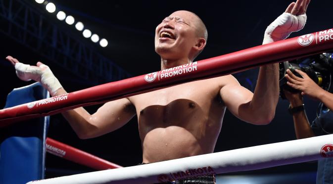 Yoshitaka Kato tak menyangka harus kalah angka mutlak dari Daud Yordan (GOH CHAI HIN / AFP)