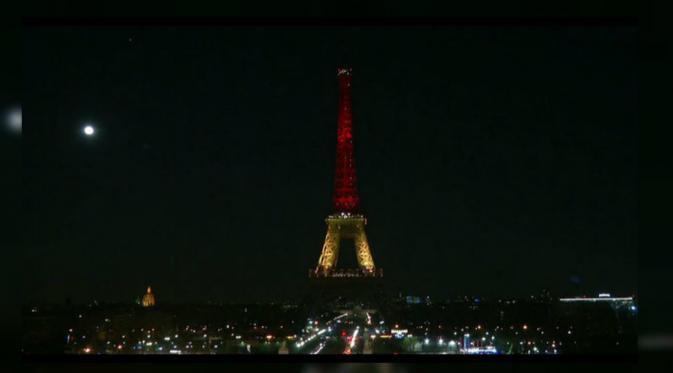 Menara Eiffel salah satu monumen dunia yang diterangi warna bendera Belgia. (Fox9)