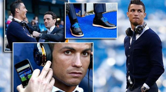 Megabintang Real Madrid, Cristiano Ronaldo, duduk di bangku penonton pada laga leg pertama semifinal Liga Champions melawan Manchester City. (Daily Mail)