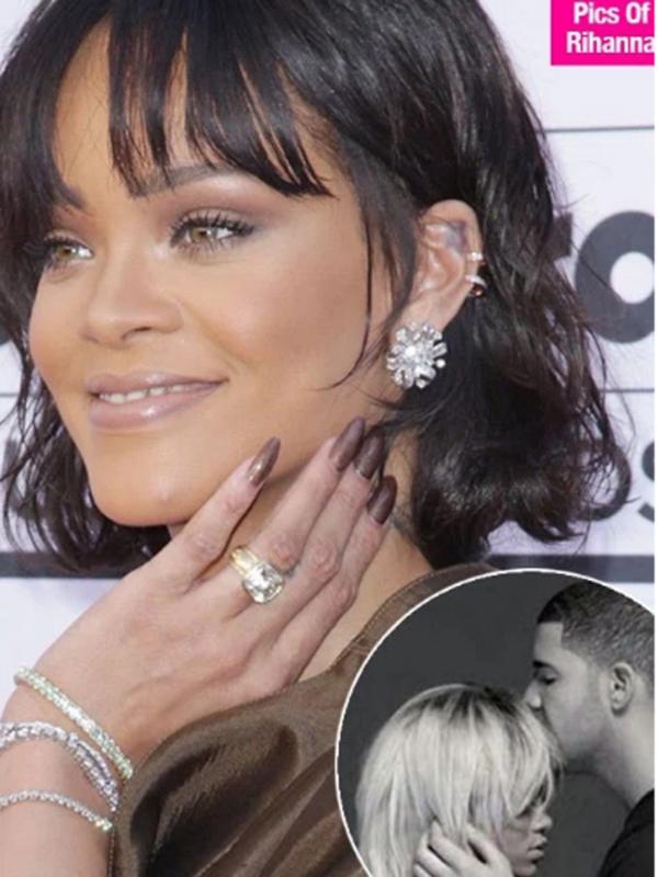 Rihanna menggunakan cincin berlian yang diduga dari Drake. (via Hollywood Life)