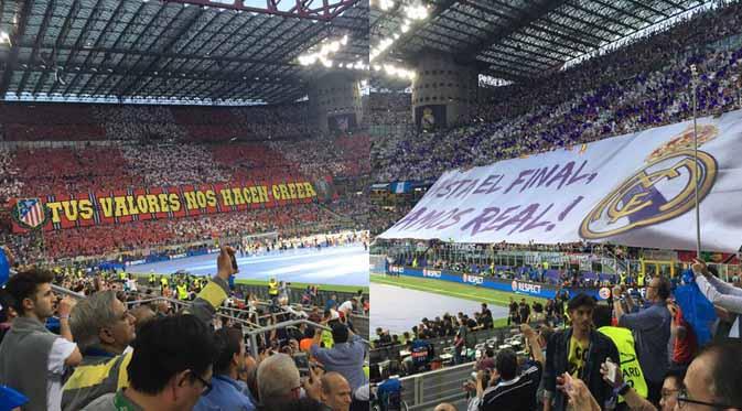 Tampak suporter Real Madrid dan Atletico Madrid membentangkan spanduk dukungan untuk klub kesayangannya masing-masing..