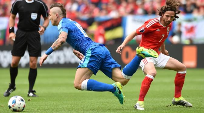  Joe Allen menjadi bagian penting dalam sukses Wales di Piala Eropa 2016. (AFP/Nicolas Tucat) 