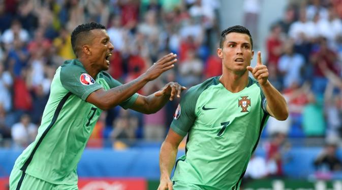 Cristiano Ronaldo mencetak 2 gol saat Portugal ditahan Hungaria, 3-3, pada laga Grup F Piala Eropa 2016 di Stade de Lyon, Lyon, Rabu (22/6/2016). (AFP/Philippe Desmazes)