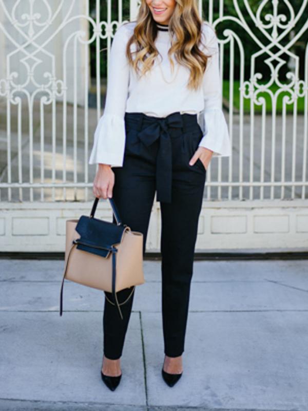 A STATEMENT BLOUSE WITH HIGH-WAISTED PANTS. Sumber : purewow.com