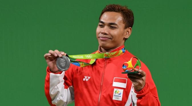 Indonesia meraih medali kedua di ajang Olimpiade Rio de Janeiro 2016 setelah lifter Eko Yuli Irawan menyabet medali perak di cabang angkat besi kelas 62 kg, Selasa (9/8/2016) pagi WIB. (AFP/Goh Chai Hin)