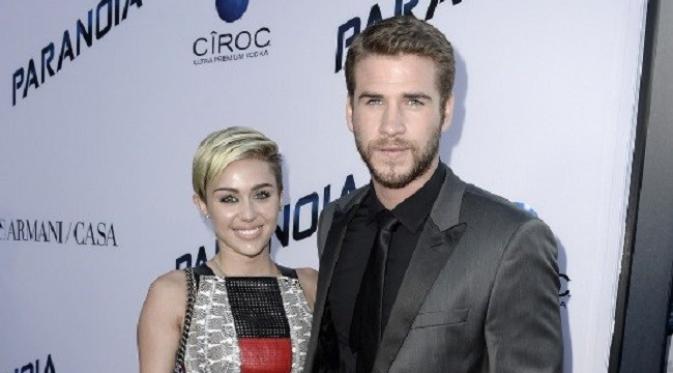 Miley Cyrus dan Liam Hemsworthm (AFP)