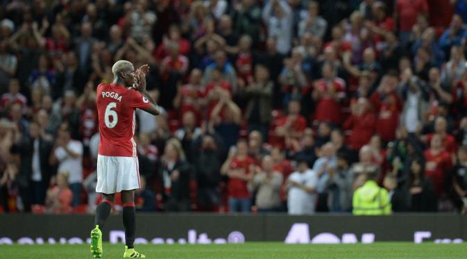 Paul Pogba kini berstatus pemain termahal di dunia setelah direkrut Manchester United di musim panas 2016. (AFP/Oli Scarff)