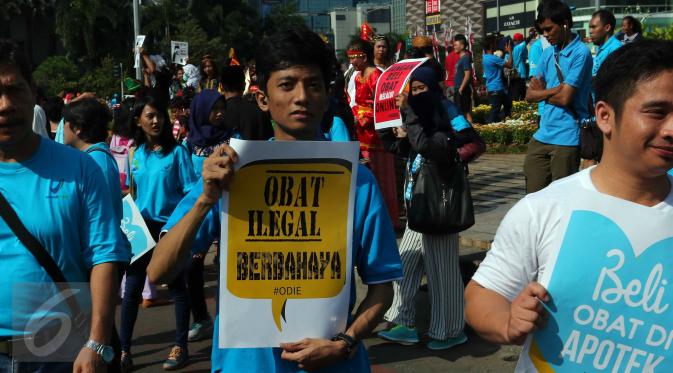 Badan Pengawas Obat dan Makanan (BPOM) melakukan aksi anti obat ilegal di Bundaran HI, Jakarta, Minggu (21/8). (Liputan6.com/Angga Yuniar)