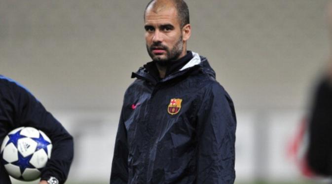 Mantan pelatih Barcelona yang kini menangani Manchester City, Josep Guardiola. (AFP/Aris Messinis).