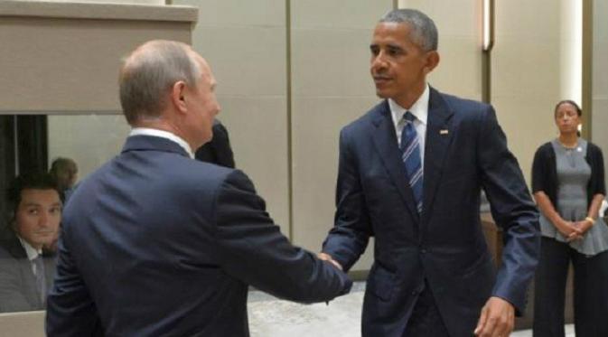 Obama bersalaman dengan Putin (Foto:Reuters)