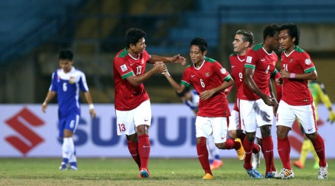 Evan Dimas dkk. merayakan gol ke gawang Laos pada penyisihan Grup A Piala AFF 2014. (AFP/STR)
