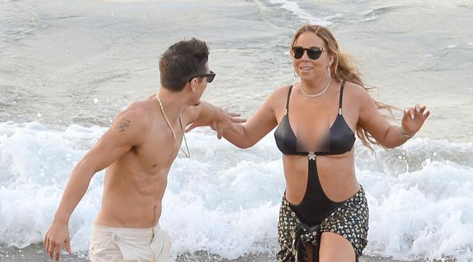 Tersebar video dimana Mariah tengah menggoda Bryan dan duduk dipangkuan pelatih koreografernya itu. Dari situlah yang menjadi awal dari kemarahan James. (doc.dailymail.com)