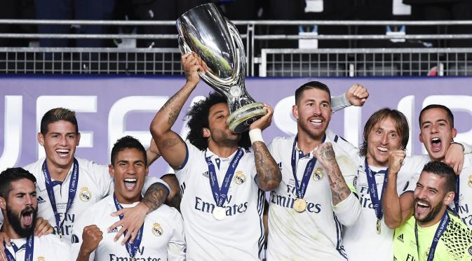 Real Madrid memastikan diri sebagai kampiun Piala Super Eropa seteah menang 3-2 atas Sevilla, di Lerkendal Stadion, Norwegia. Gelar Piala Super Eropa tahun ini adalah yang kali ketiga dalam sejarah Real Madrid. (AFP/Jonatahn Nackstrand)