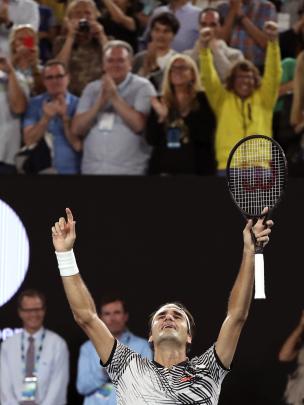 Ekspresi Roger Federer setelah memastikan kemenangan atas Rafael Nadal di final Australia Terbuka 2017, Minggu (29/1/2017). (AP Photo/Aaron Favila)
