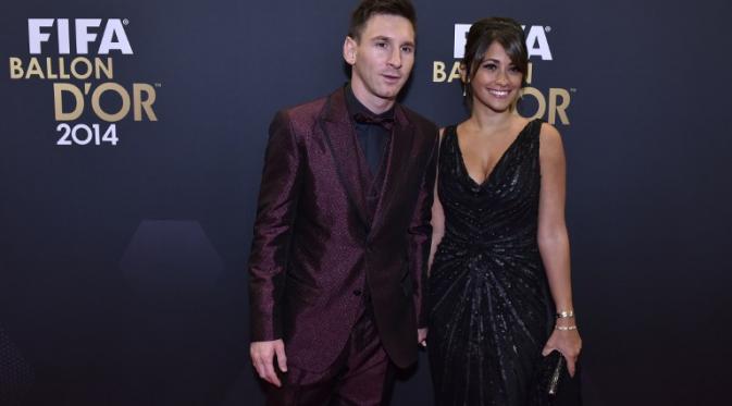 Lionel Messi dan Antonella Roccuzzo (MICHAEL BUHOLZER / AFP)