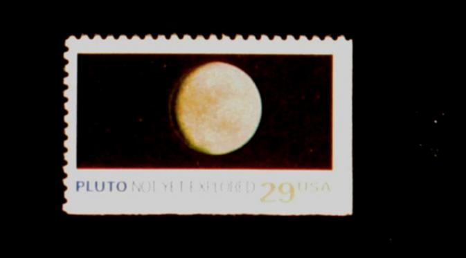 Perangko Pluto 1991. (JHU/NASA)