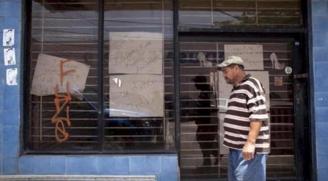 Toko-toko tutup sepanjang san Juan (Reuters)