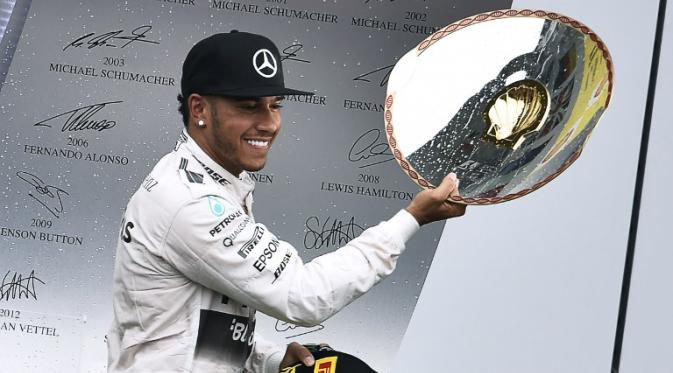 Lewis Hamilton ekspresikan kemenangan di Belgia (JOHN THYS / AFP)