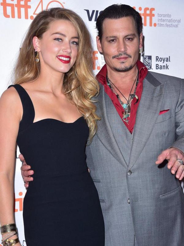 Johnny Depp dan Amber Heard (via telegraph.co.uk)